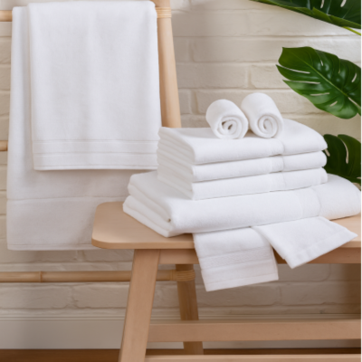 Hand towels arranged near a wash basin