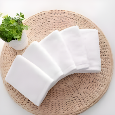 White face towels on a woven mat