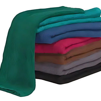 Folded spa towels on treatment table